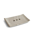 handcrafted sand ceramic soap dish designed to keep soap dry with a minimalist, natural finish