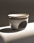 full view of handmade sand ceramic oil burner set