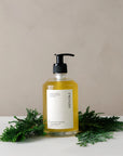 Japanese Cypress Hinoki Body Wash in a glass pump jar