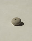 bottom view of mini grey pebble incense holder