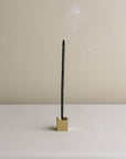 burning incense stick with cubic incense holder