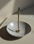 incense stick with incense holder with a brass placing on the incense bowl