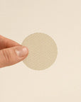 person holding a brass mesh screen for resin burner, designed for even burning and protection