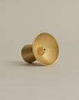 sleek conical brass incense holder designed with a modern aesthetic for elegant incense burning
