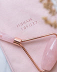 rose quartz facial roller with a pouch
