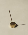 flower shaped brass incense holder with floral Japanese incense stick