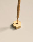 flower brass incense holder with Palo Santo incense stick