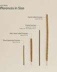 Four natural incense sticks in different lengths displayed side by side