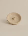Top view of travertine incense plate, revealing natural variations in the stone surface