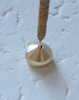 an incense stick with a medium waterdrop incense holder made of brass