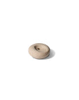 Pebble-shaped mini incense holder made of beige ceramic