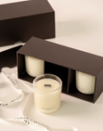 Three mini wellness candles taken from the gift box, offering a calming fragrance for a peaceful atmosphere