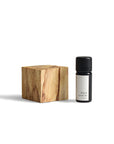 Natural wood cubic diffuser paired with 10ml Palo Santo essential oil, perfect for relaxation and ambiance.