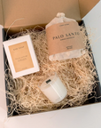 palo santo bath flakes, palo santo bar soap, and mantra mini candle displayed with a gift box, ideal for a thoughtful gift set