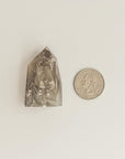 grey phantom quartz and quarter dollar coin