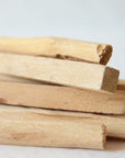 Close-up of premium Palo Santo wood sticks sustainably harvested from Ecuador for spiritual cleansing rituals