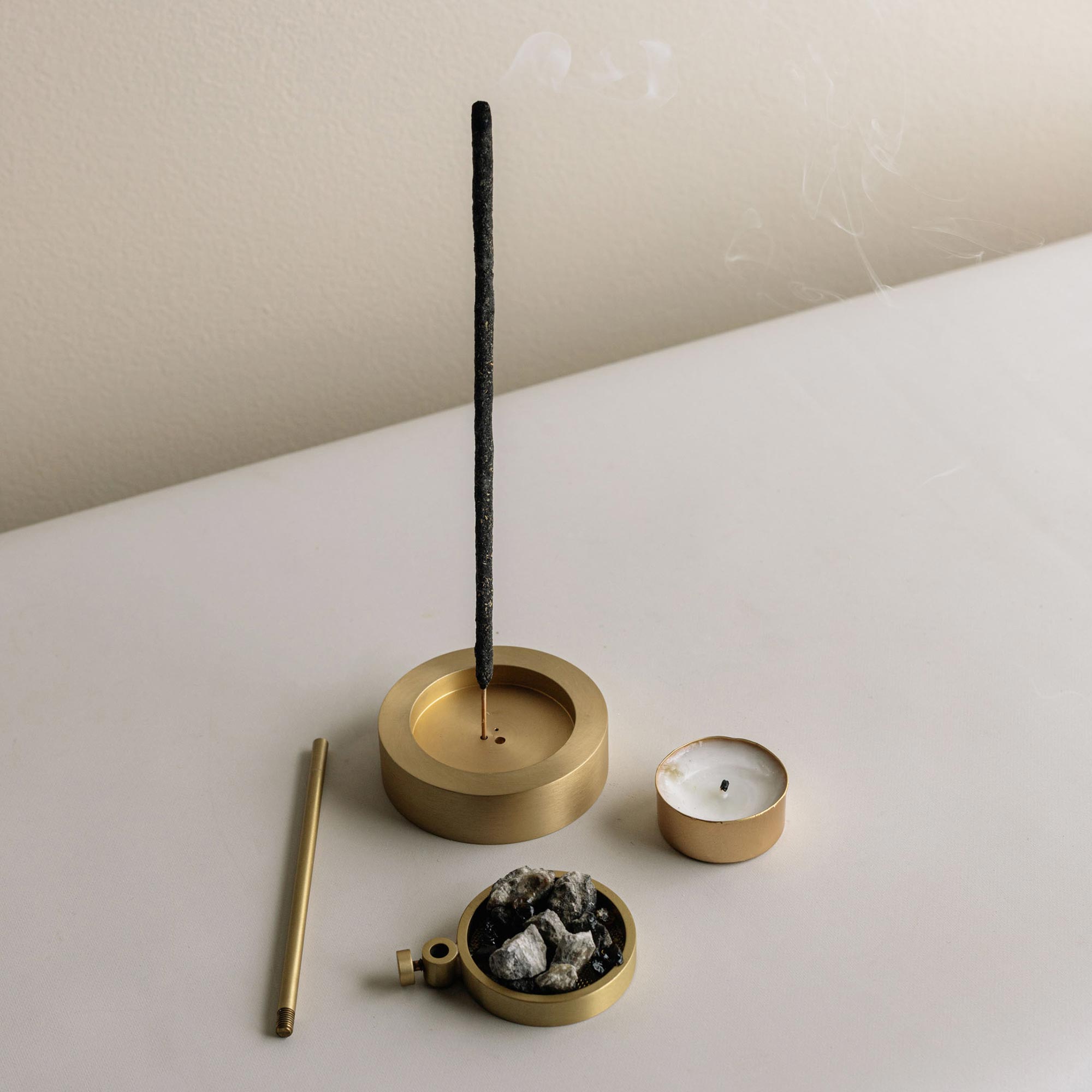 candle and brass burner with incense stick and resin 