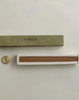 incense sticks on the built-in insert and brass incense holder on the side