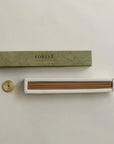 incense sticks on the built-in insert and brass incense holder on the side