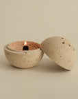 incense cone burning on a spherical travertine incense burner, offering a natural and minimalist design for incense burning