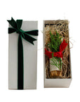 Palo Santo housewarming gift set in white box with green velvet ribbon and hand-tied greenery with red bow — Cedar & Myrrh Warm Welcome Set1