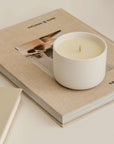 wellness candle on the book