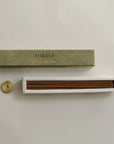 white sage incense sticks on the insert and brass incense holder on the side
