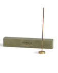 white sage incense with a brass incense holder and the packaging box behind