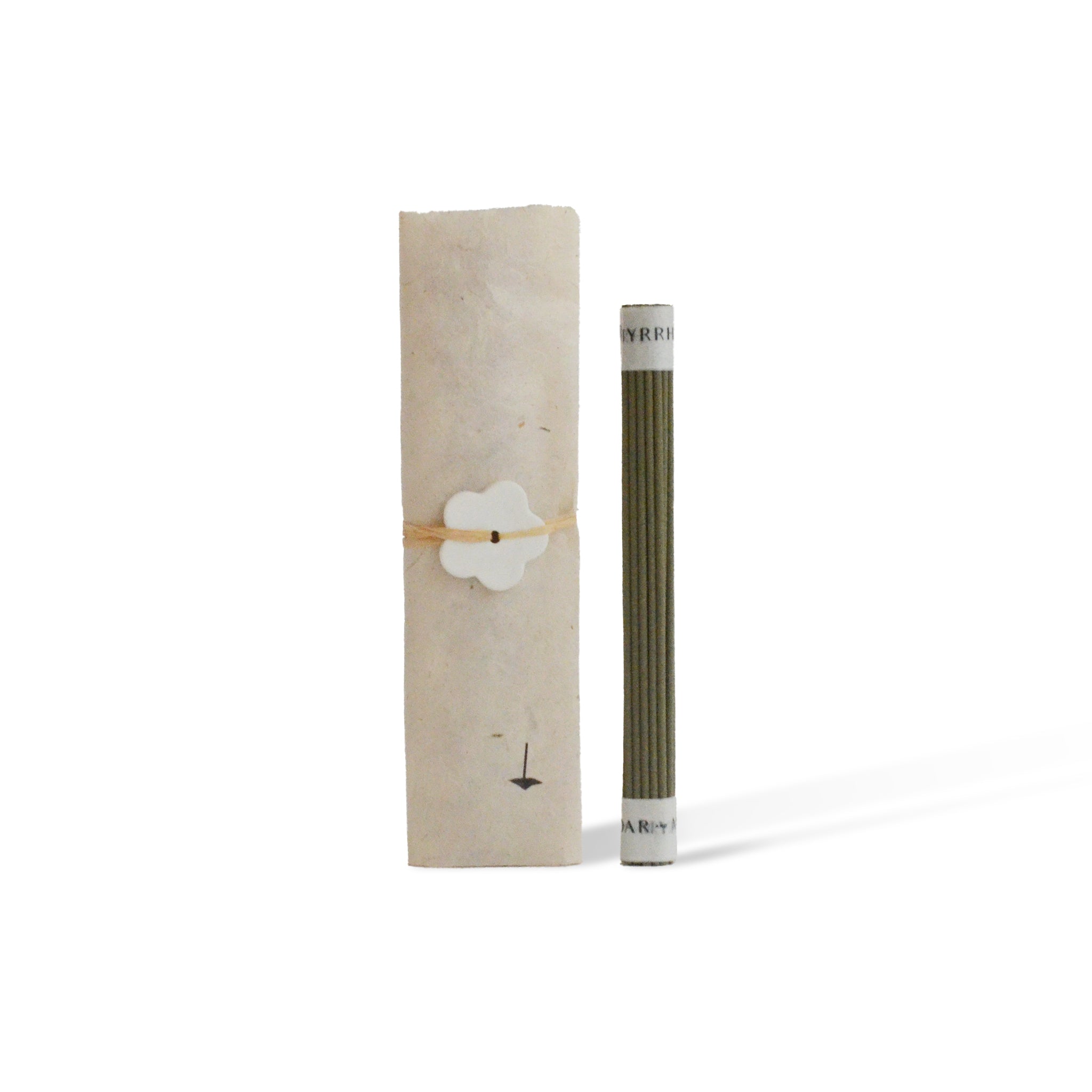 Minimalist packaging of Japanese Hinoki incense with an mulberry paper wrap tied with a ceramic flower shape incense holder. 