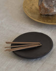 several sticks of Japanese incense placing on the incense plate