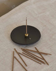 burning Japanese incense on the incense holder and plate