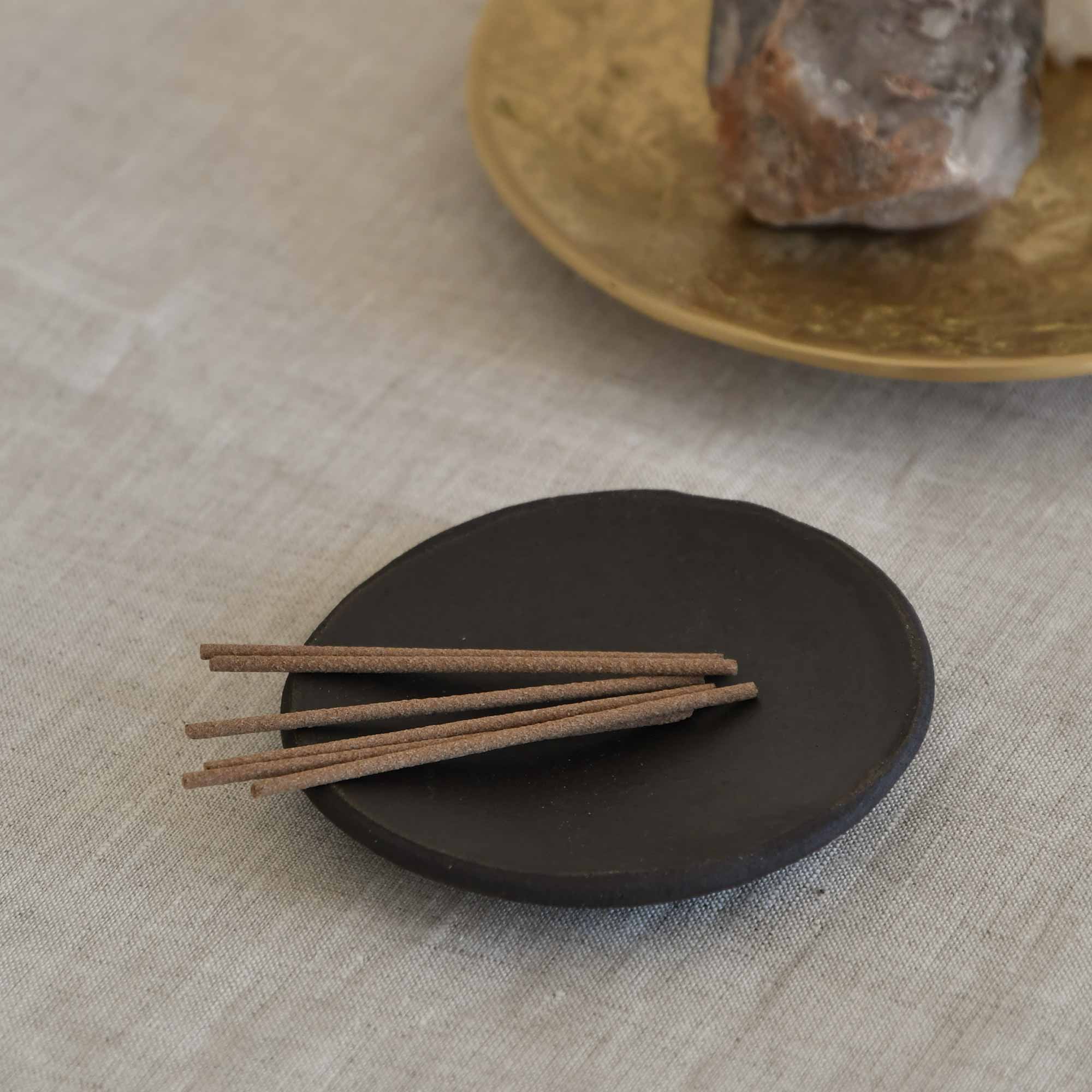 several Japanese incense on the ceramic incense plate