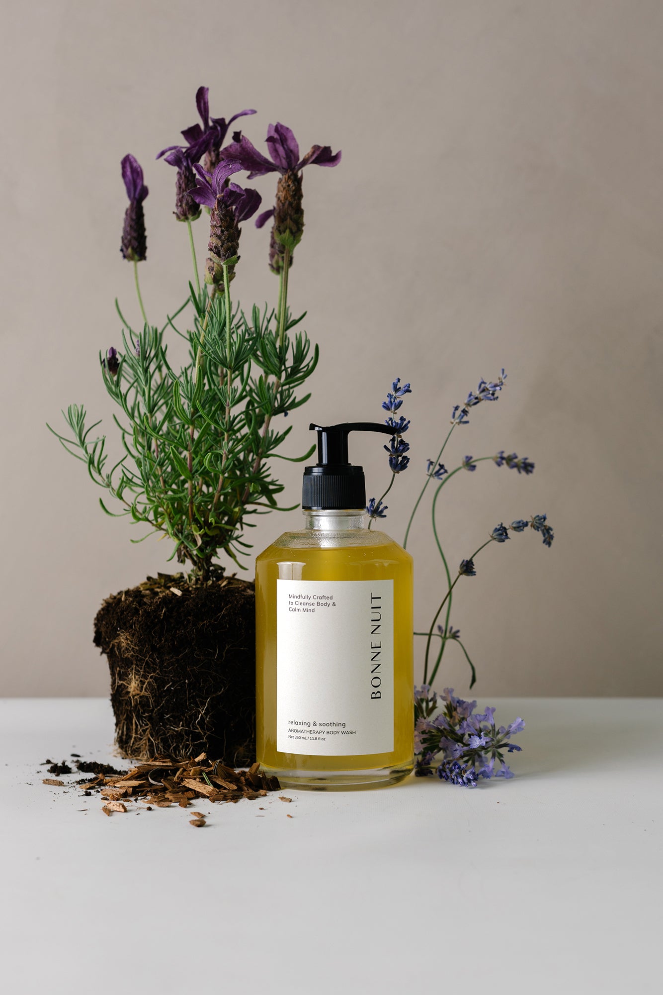 Organic body wash in glass pump bottle with lavender.