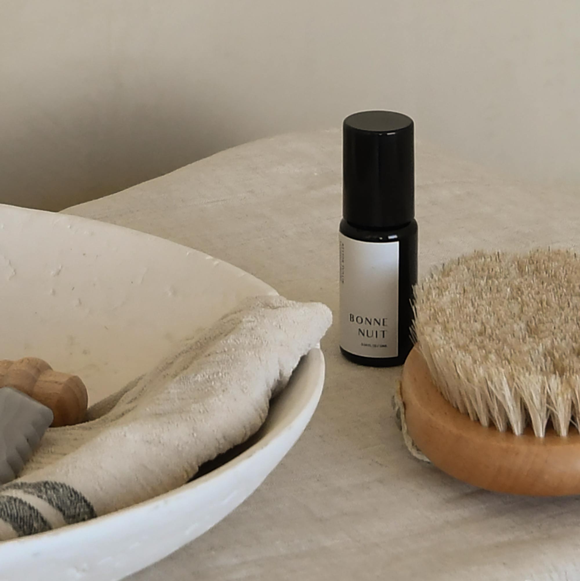 aromatherapy roller on the table with bath essentials
