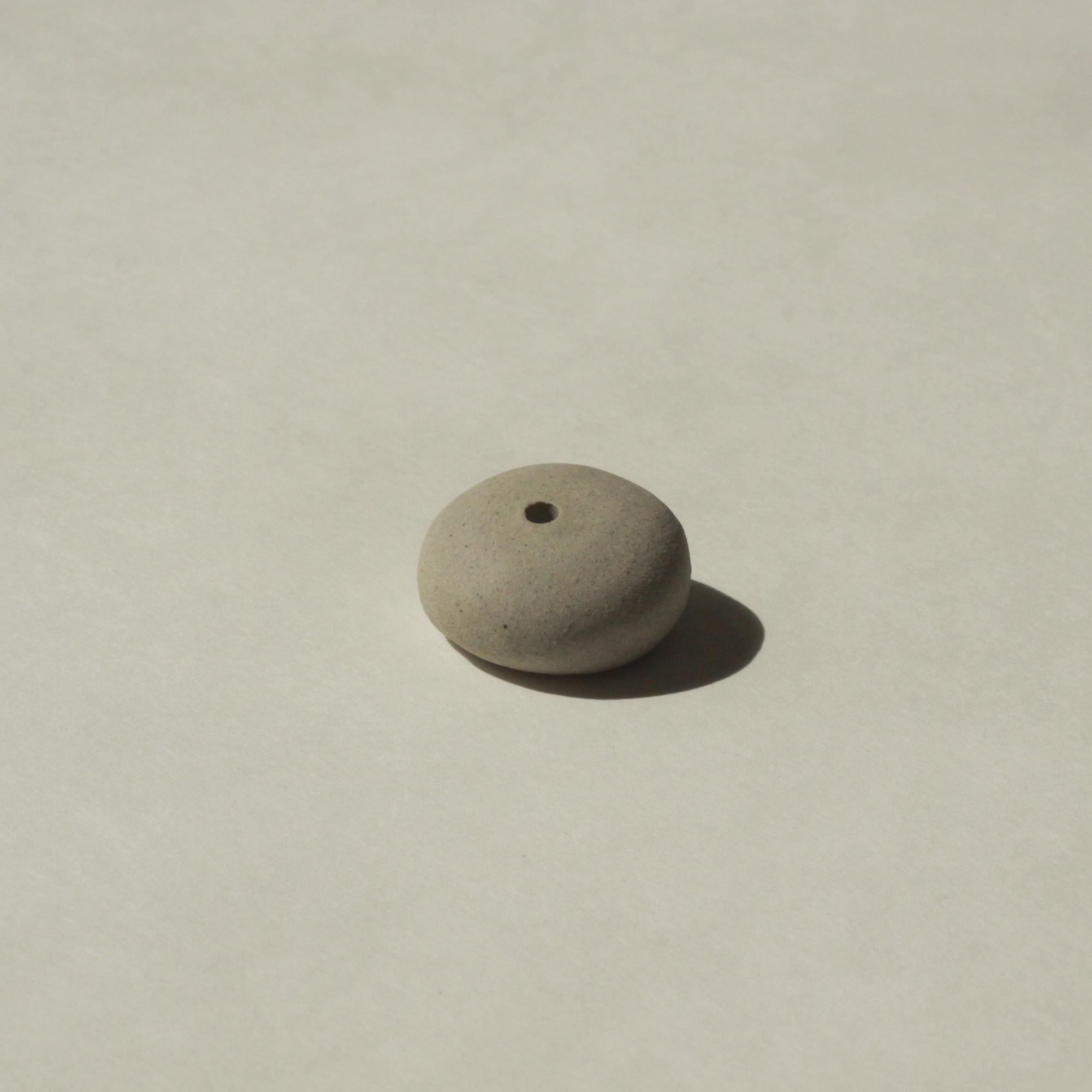 bottom view of mini grey pebble incense holder
