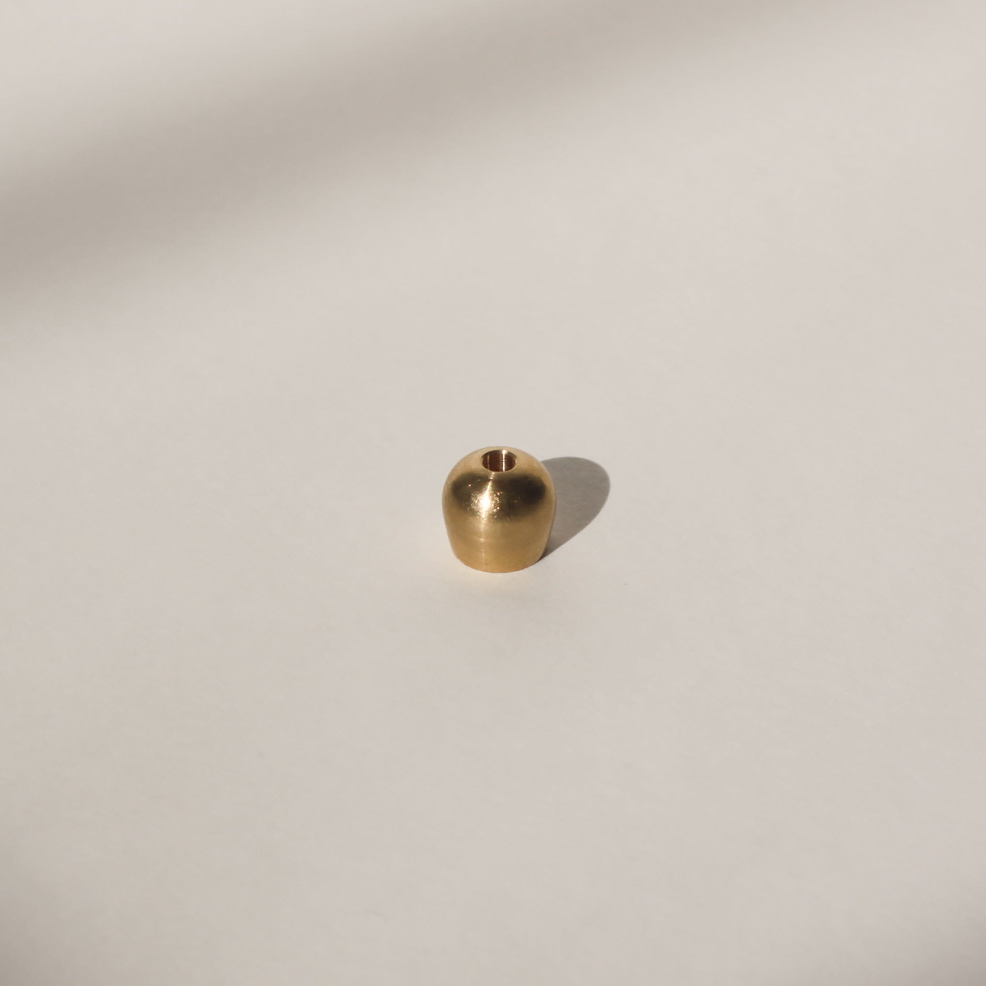 top view of brass ellipse incense holder