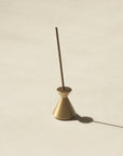 brass hourglass incense holder with Japanese incense stick