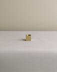 incense holder with a cubic shape and a brass