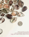 quarter coin and different garden quartz with different size, pattern and hue