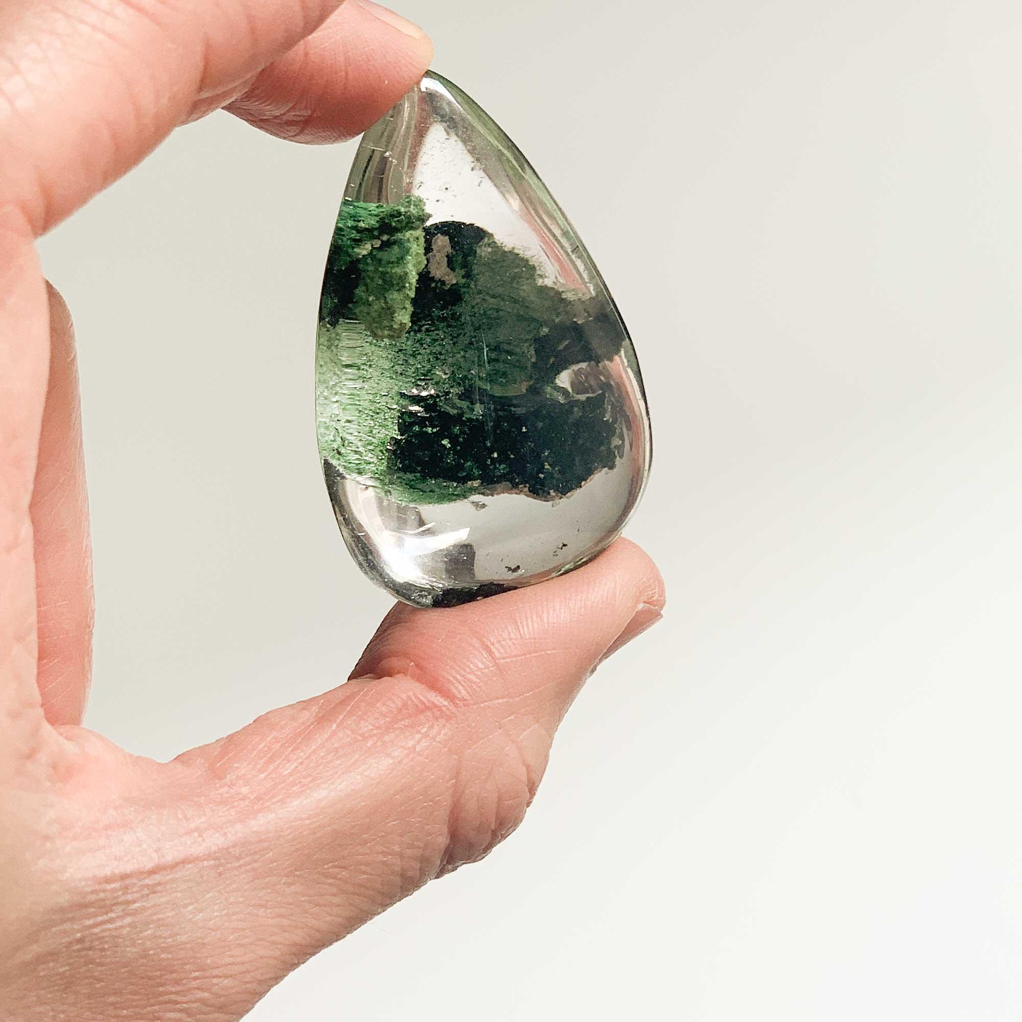 holding large green ghost crystal