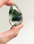 holding large green ghost crystal