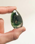 holding medium sized green ghost crystal