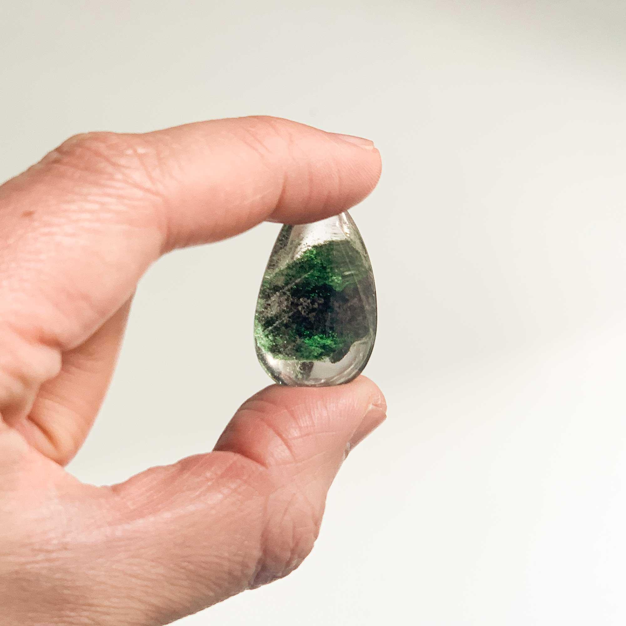 holding mini green ghost crystal