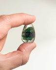 holding mini green ghost crystal