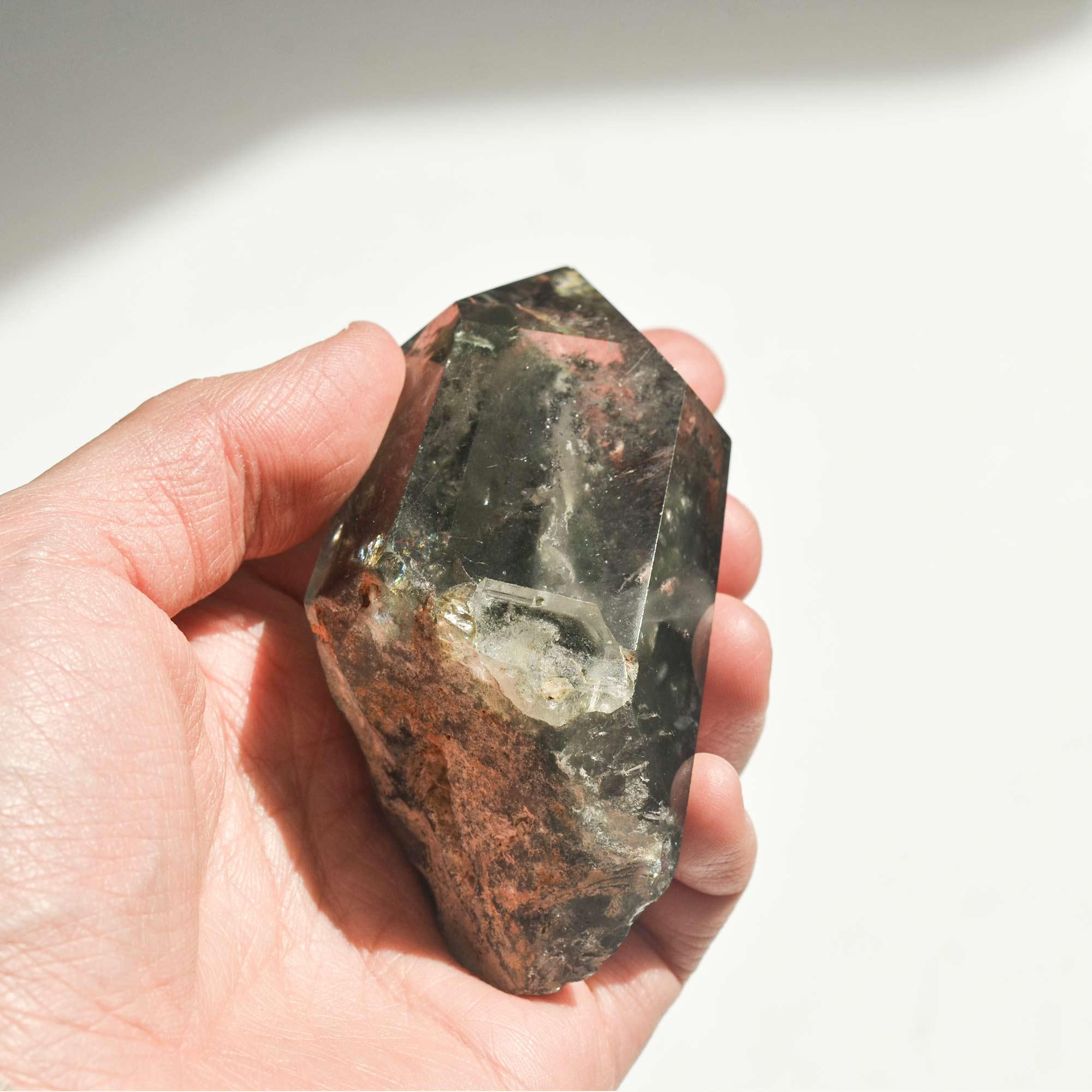holding slanted phantom quartz crystal