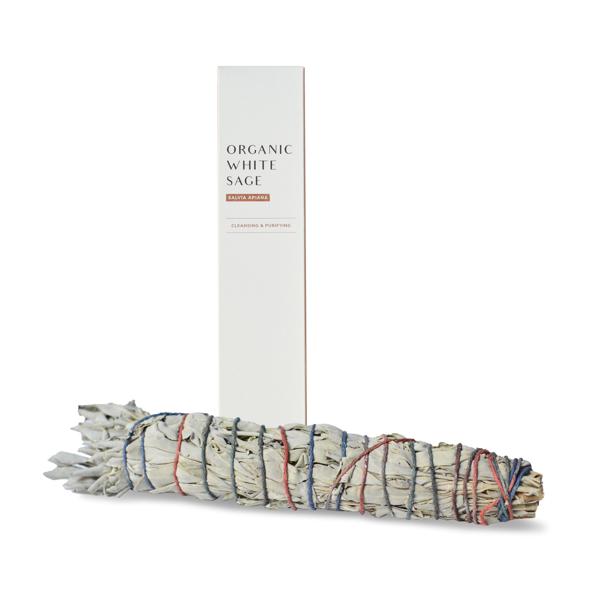 Large white sage smudge stick and a package at the back.