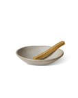 smudge stick on the light grey ceramic incense bowl
