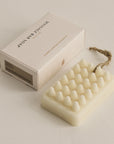 Hinoki massage soap bar with textured surface and packaging box on the side