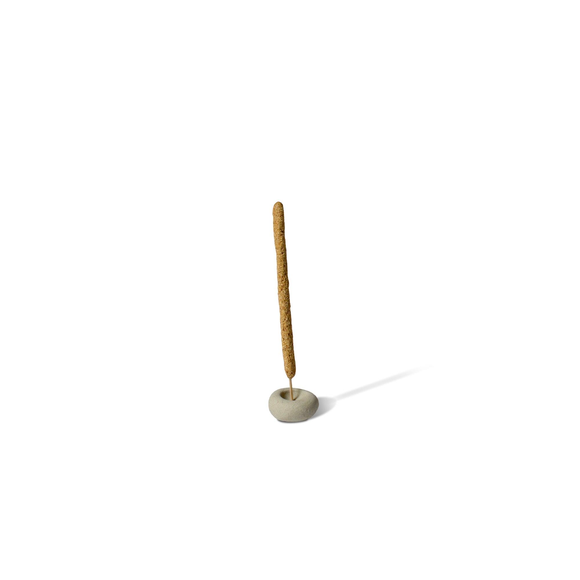 an incense stick with mini light grey ceramic pebble-shaped incense holder