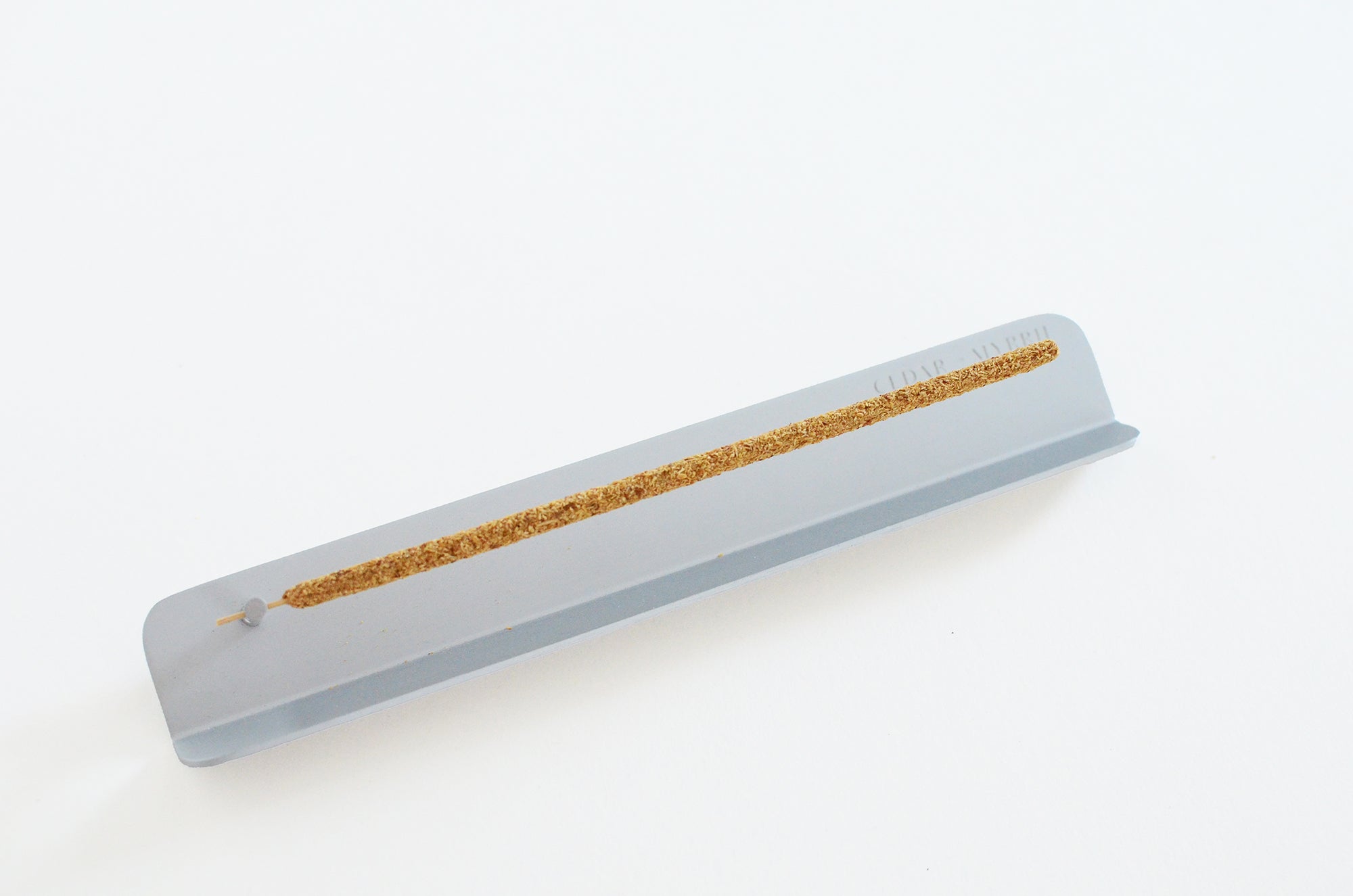 Minimal aluminum incense holder with stick incense for clean ash burning
